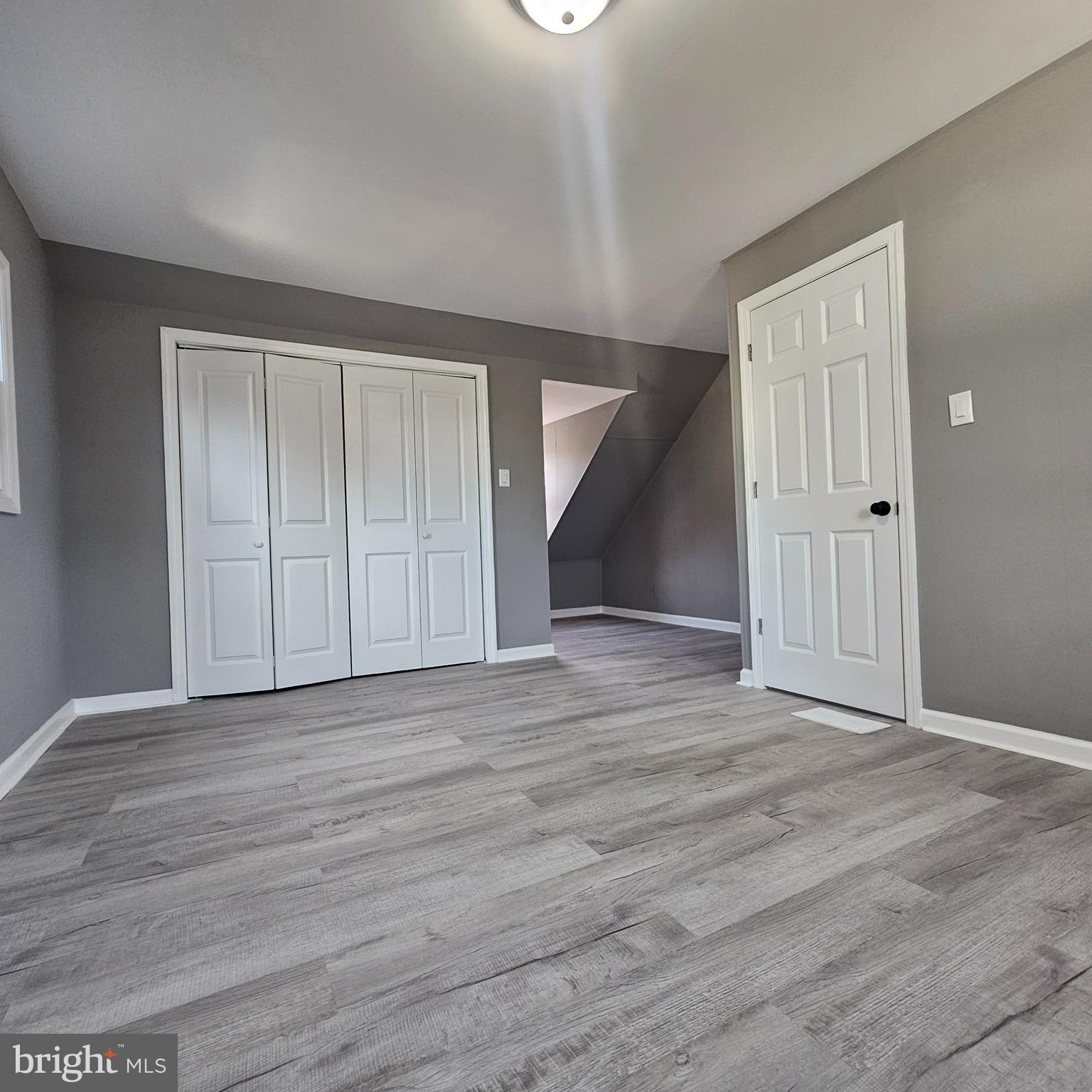 41 Churchtown Road Pennsville, NJ 08070 - Photo 12 of 16 a view of an empty room with wooden floor and closet