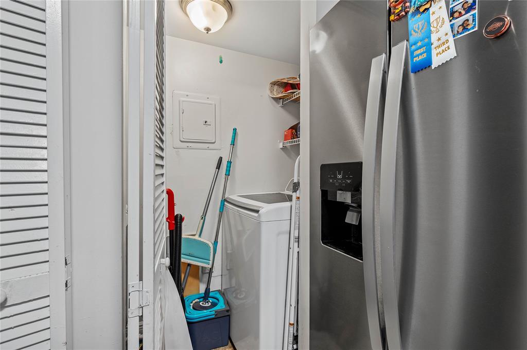 4840 North State Road 7, Unit 6304 Pompano Beach, FL 33073 - Photo 16 of 18 a view of walk in closet with clothes and shoes
