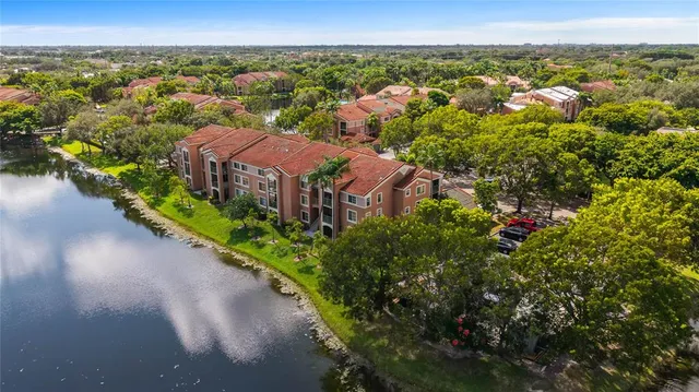 an aerial view of house with yard swimming pool and outdoor seating