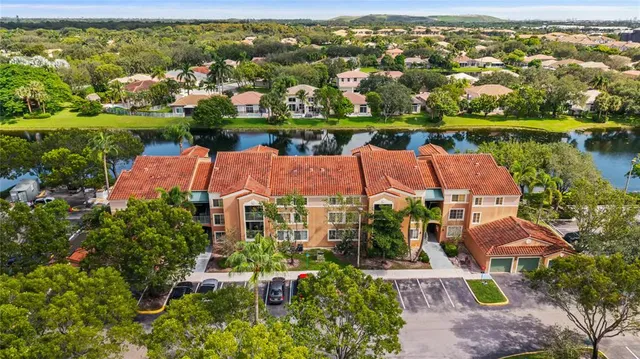 an aerial view of a house with a lake view