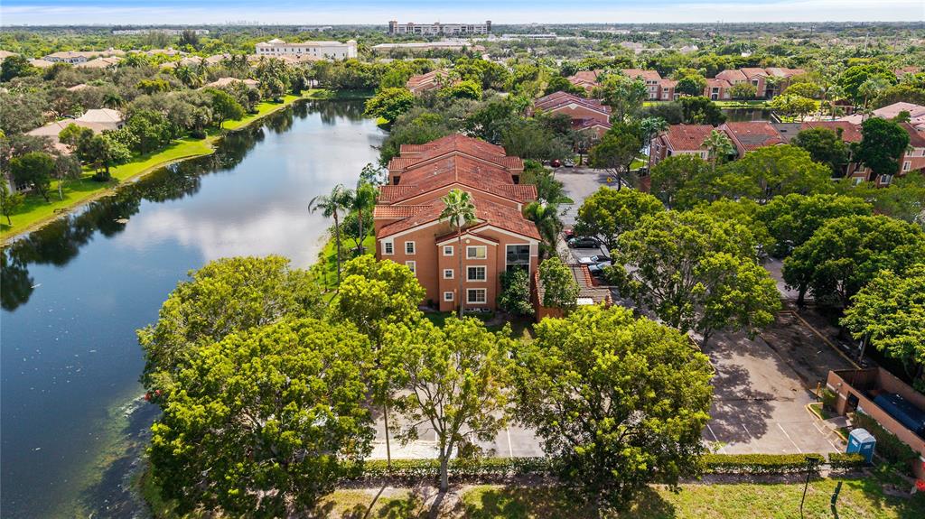 4840 North State Road 7, Unit 6304 Pompano Beach, FL 33073 - Photo 4 of 18 an aerial view of a house with a lake view