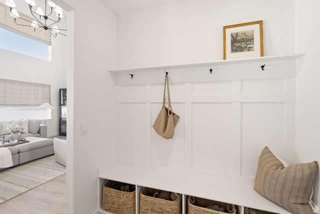 870 North Ada Loop Lehi, UT 84048 - Photo 17 of 51 Built-in mudroom bench with board and batten detailing, integrated hooks, and cubby storage