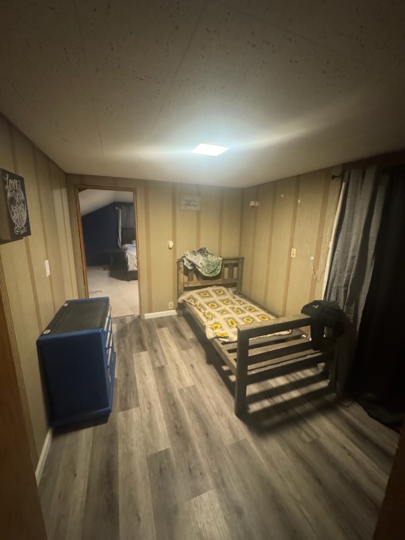 405 West Cleveland Street Spring Valley, IL 61362 - Photo 11 of 21 a spacious bedroom with a bed and wooden floor