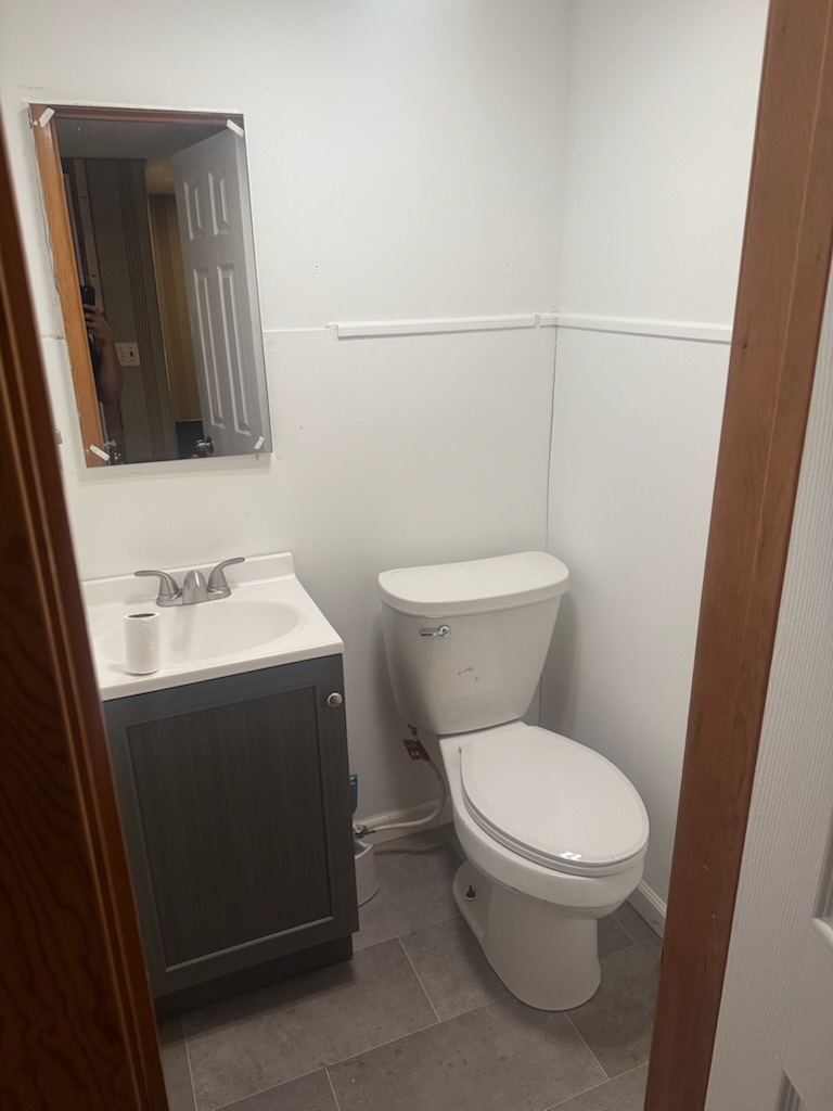 405 West Cleveland Street Spring Valley, IL 61362 - Photo 12 of 21 a white toilet sitting next to a bathroom sink