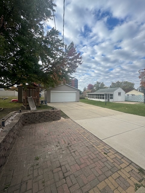 405 West Cleveland Street Spring Valley, IL 61362 - Photo 17 of 21 a view of a yard with plants and a trees