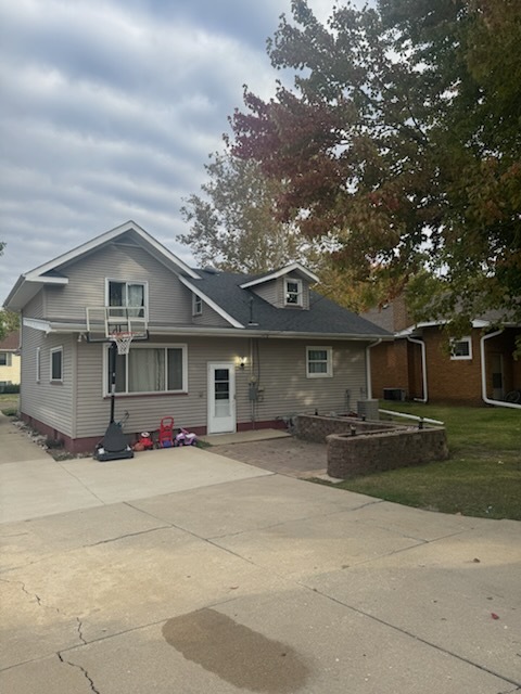 405 West Cleveland Street Spring Valley, IL 61362 - Photo 20 of 21 a front view of a house with a yard and garage