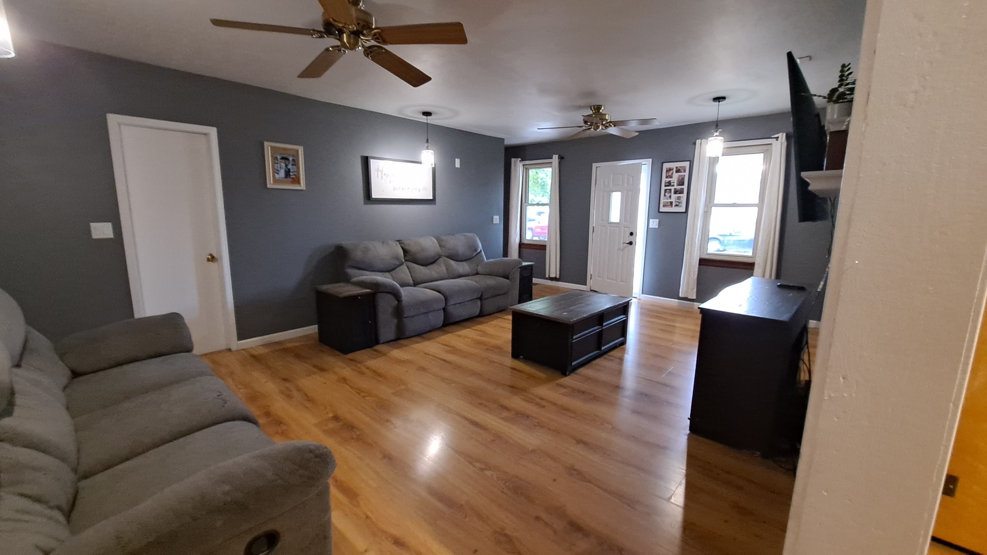 405 West Cleveland Street Spring Valley, IL 61362 - Photo 2 of 21 a living room with furniture and a chandelier