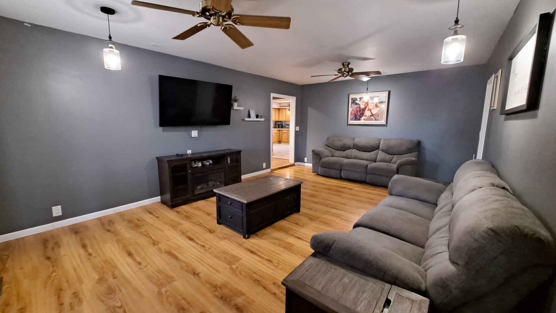 405 West Cleveland Street Spring Valley, IL 61362 - Photo 3 of 21 a living room with furniture and a flat screen tv
