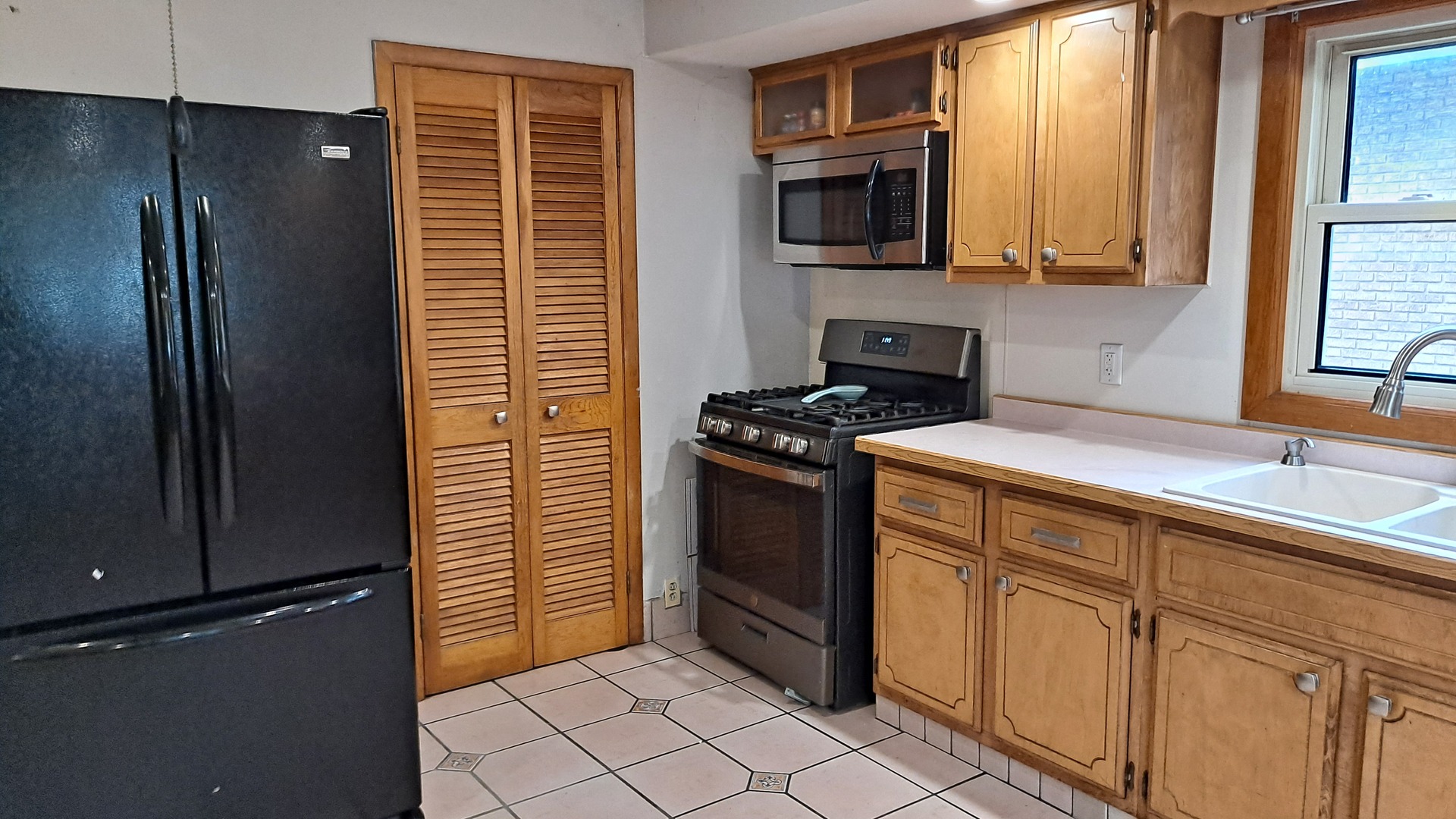 405 West Cleveland Street Spring Valley, IL 61362 - Photo 5 of 21 a kitchen with stainless steel appliances granite countertop a refrigerator and a sink