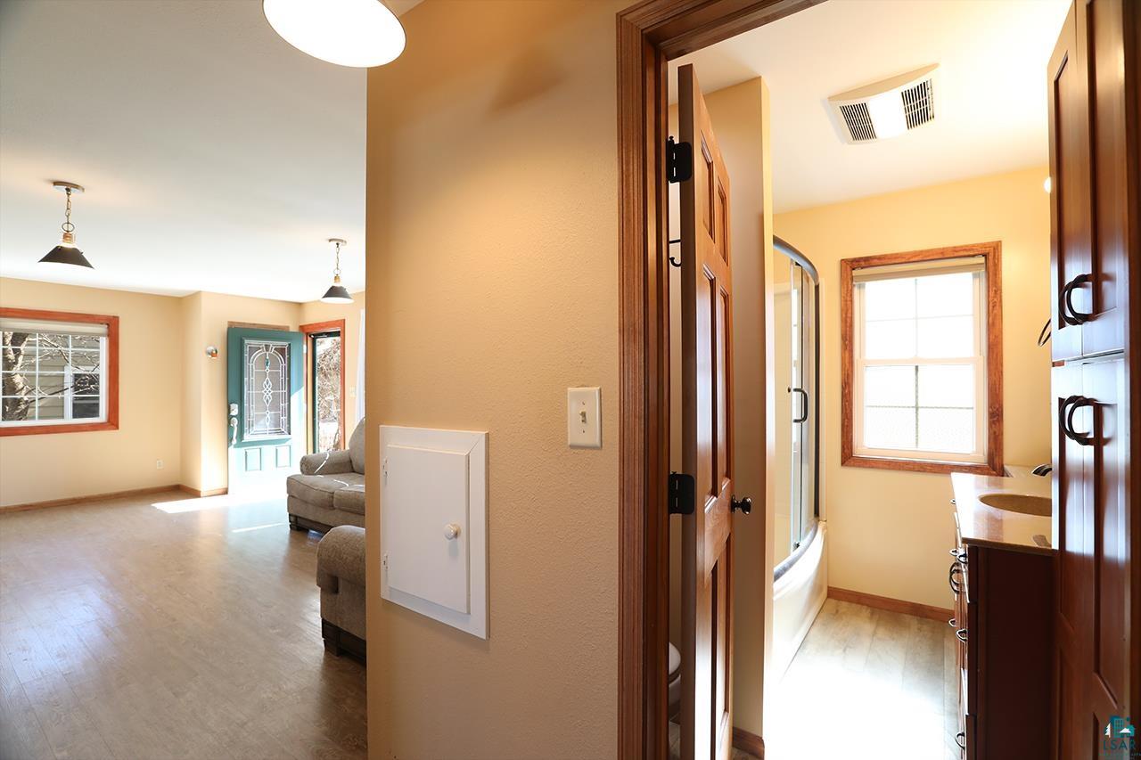 811 7th Street North Virginia, MN 55792 - Photo 17 of 37 Hallway with light wood-type flooring and baseboards