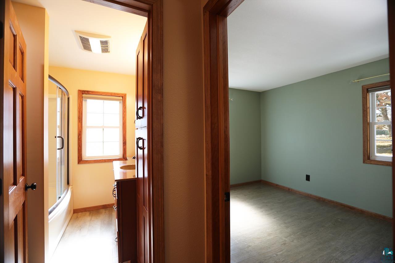 811 7th Street North Virginia, MN 55792 - Photo 20 of 37 Corridor featuring light wood finished floors