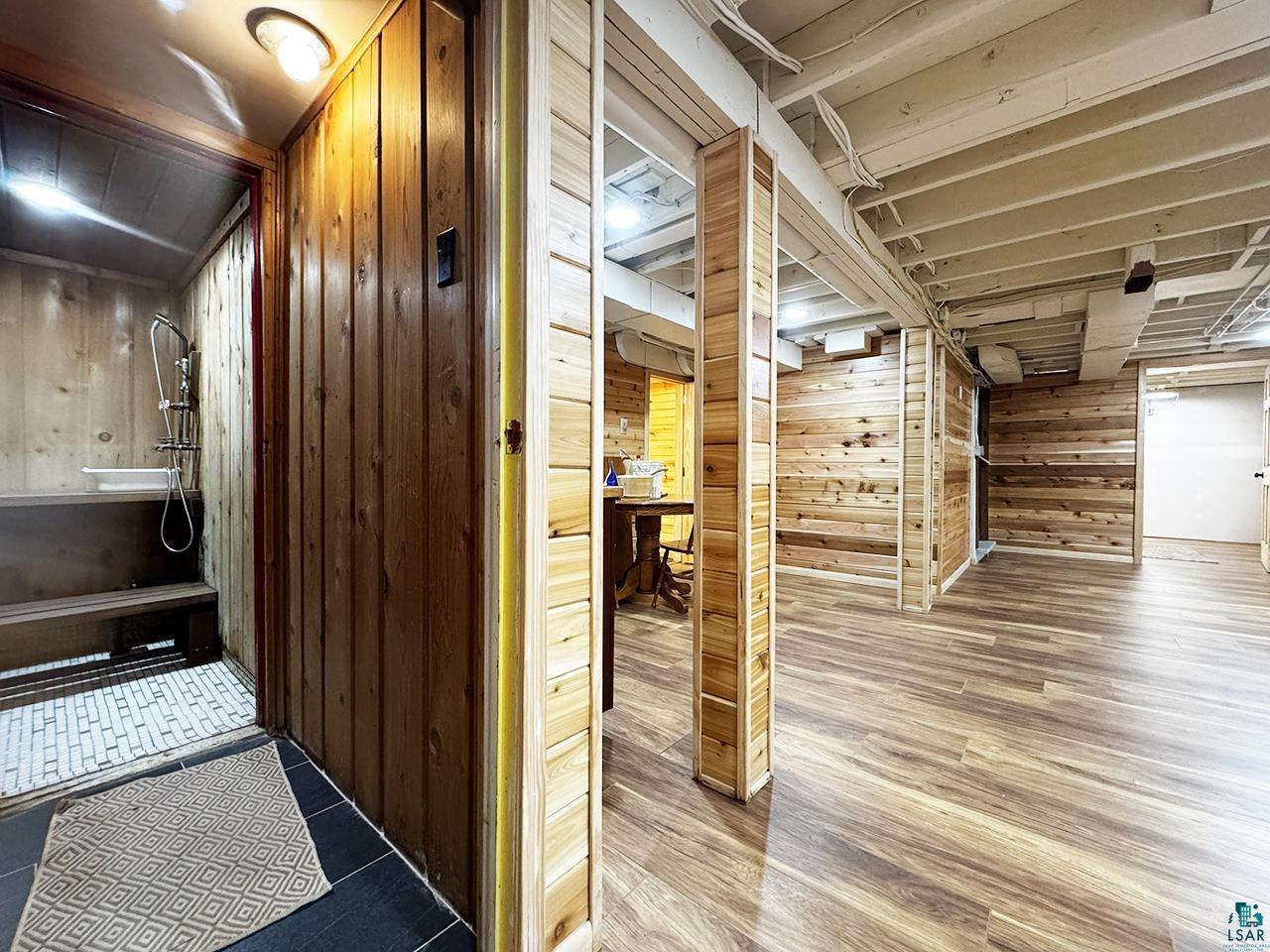 811 7th Street North Virginia, MN 55792 - Photo 28 of 37 Hall featuring wood walls and wood finished floors