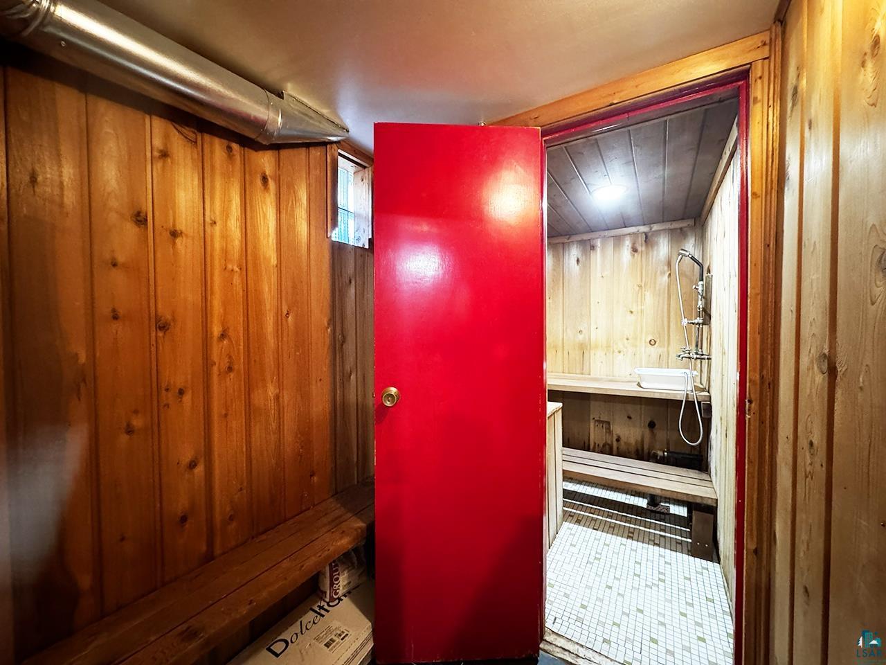 811 7th Street North Virginia, MN 55792 - Photo 30 of 37 Interior space with wooden walls and a relaxing sauna