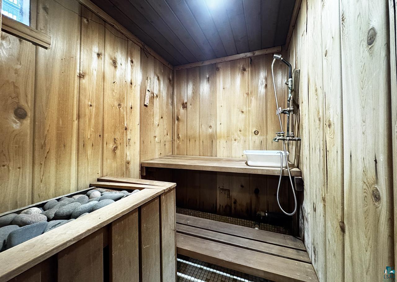 811 7th Street North Virginia, MN 55792 - Photo 31 of 37 Relaxing sauna featuring wooden walls and wood ceiling