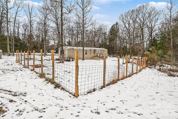 a view of a wooden fence