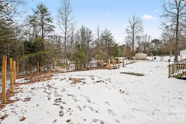 a view of a yard covered in snow