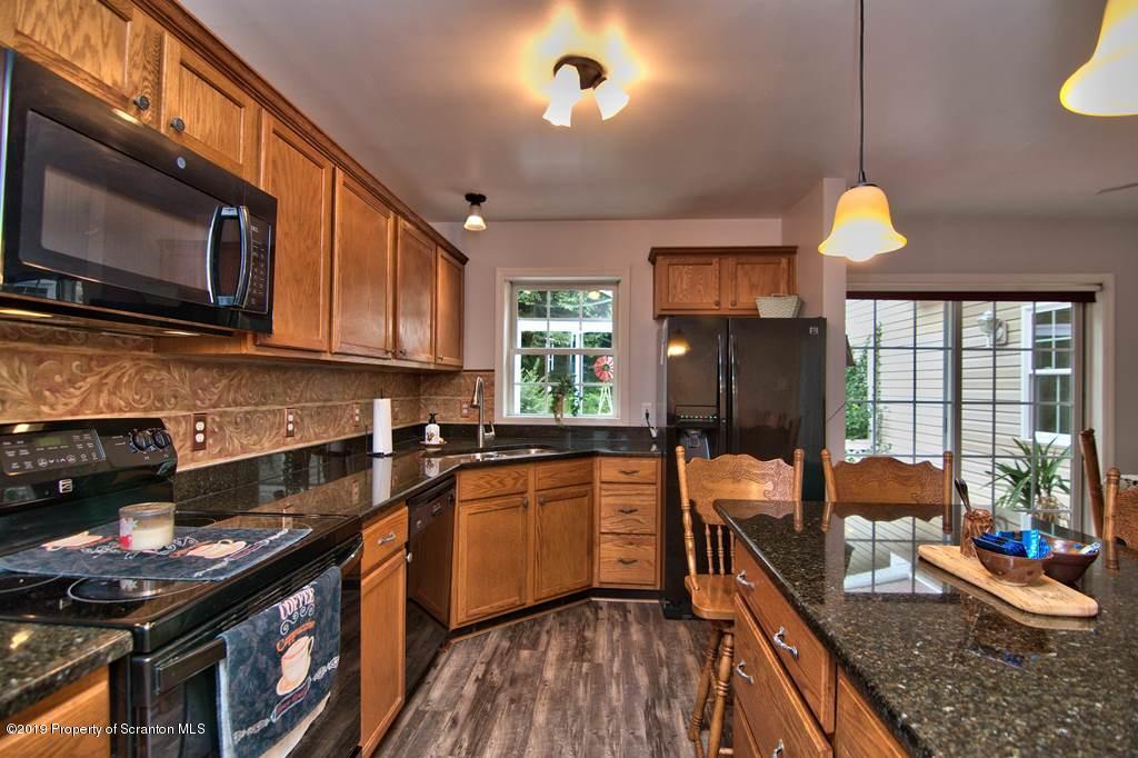 212 Summit Woods Road Moscow, PA 18444 - Photo 18 of 68 a kitchen with granite countertop lots of counter top space