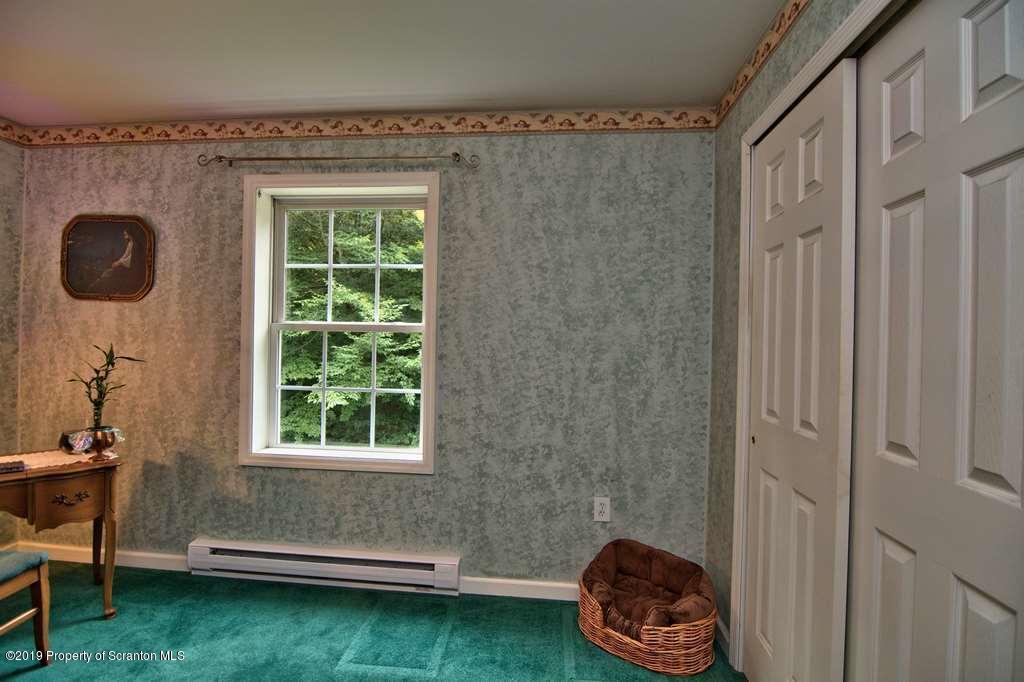 212 Summit Woods Road Moscow, PA 18444 - Photo 27 of 68 a room with a window and a fan