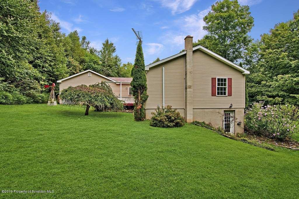 212 Summit Woods Road Moscow, PA 18444 - Photo 4 of 68 a view of a house with a yard