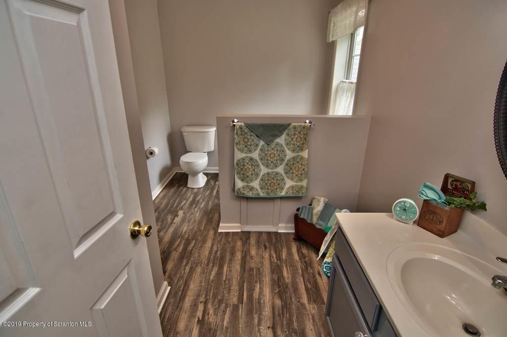 212 Summit Woods Road Moscow, PA 18444 - Photo 43 of 68 a bathroom with a sink a toilet and a bathtub