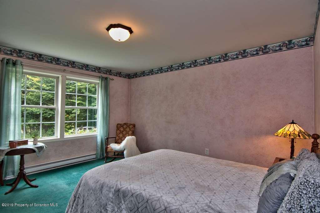 212 Summit Woods Road Moscow, PA 18444 - Photo 45 of 68 a bedroom with a bed and a window