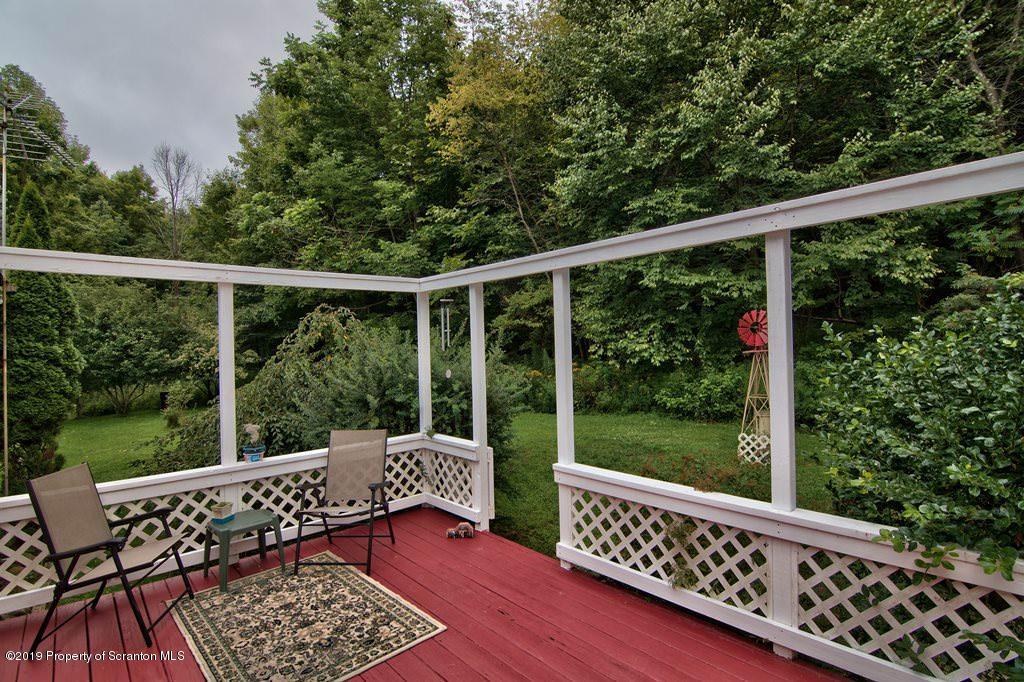 212 Summit Woods Road Moscow, PA 18444 - Photo 52 of 68 a view of balcony with wooden floor and outdoor seating