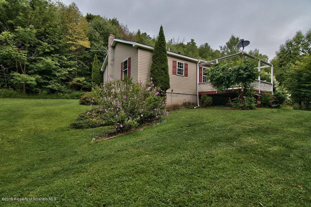 212 Summit Woods Road Moscow, PA 18444 - Photo 58 of 68 a house view with a garden space