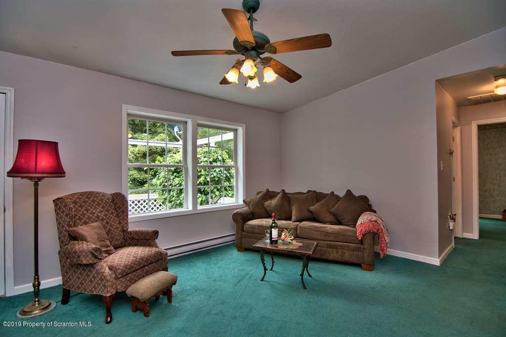 212 Summit Woods Road Moscow, PA 18444 - Photo 6 of 68 a living room with furniture and a large window