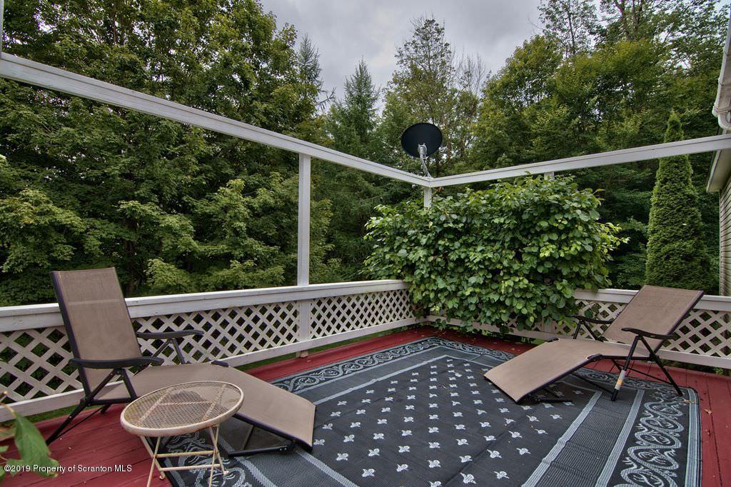 212 Summit Woods Road Moscow, PA 18444 - Photo 61 of 68 a view of a chairs and table in the roof deck