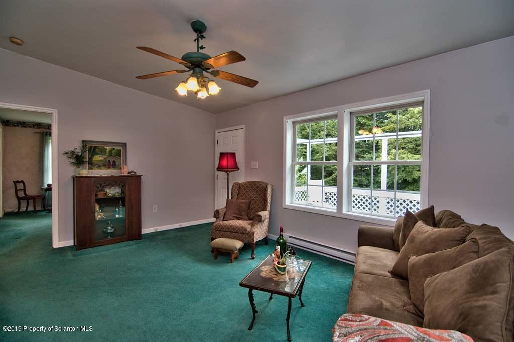212 Summit Woods Road Moscow, PA 18444 - Photo 7 of 68 a living room with furniture and a window