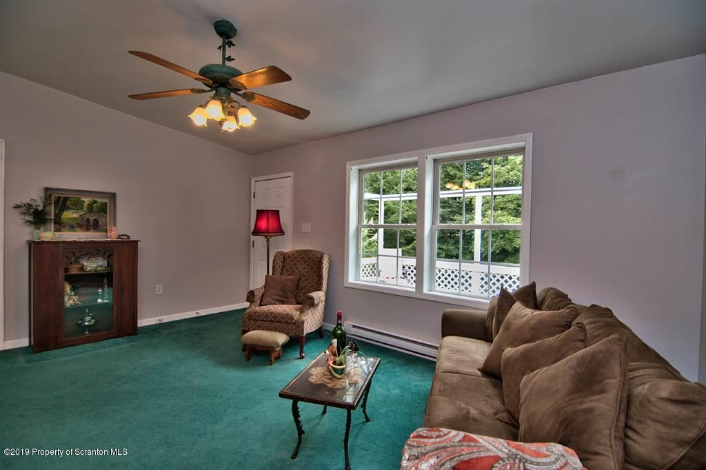 212 Summit Woods Road Moscow, PA 18444 - Photo 8 of 68 a living room with furniture and a window