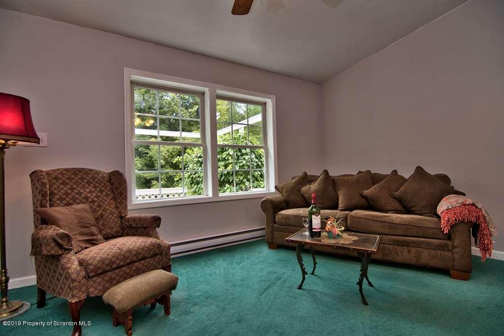 212 Summit Woods Road Moscow, PA 18444 - Photo 9 of 68 a living room with furniture and a large window