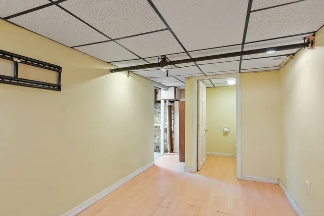 a view of a room with wooden walls