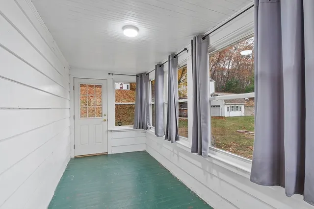 a view of a closet area with wooden floor