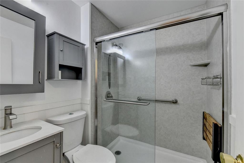 1577 Harbour Oaks Road Tucker, GA 30084 - Photo 38 of 58 a bathroom with a toilet sink and shower