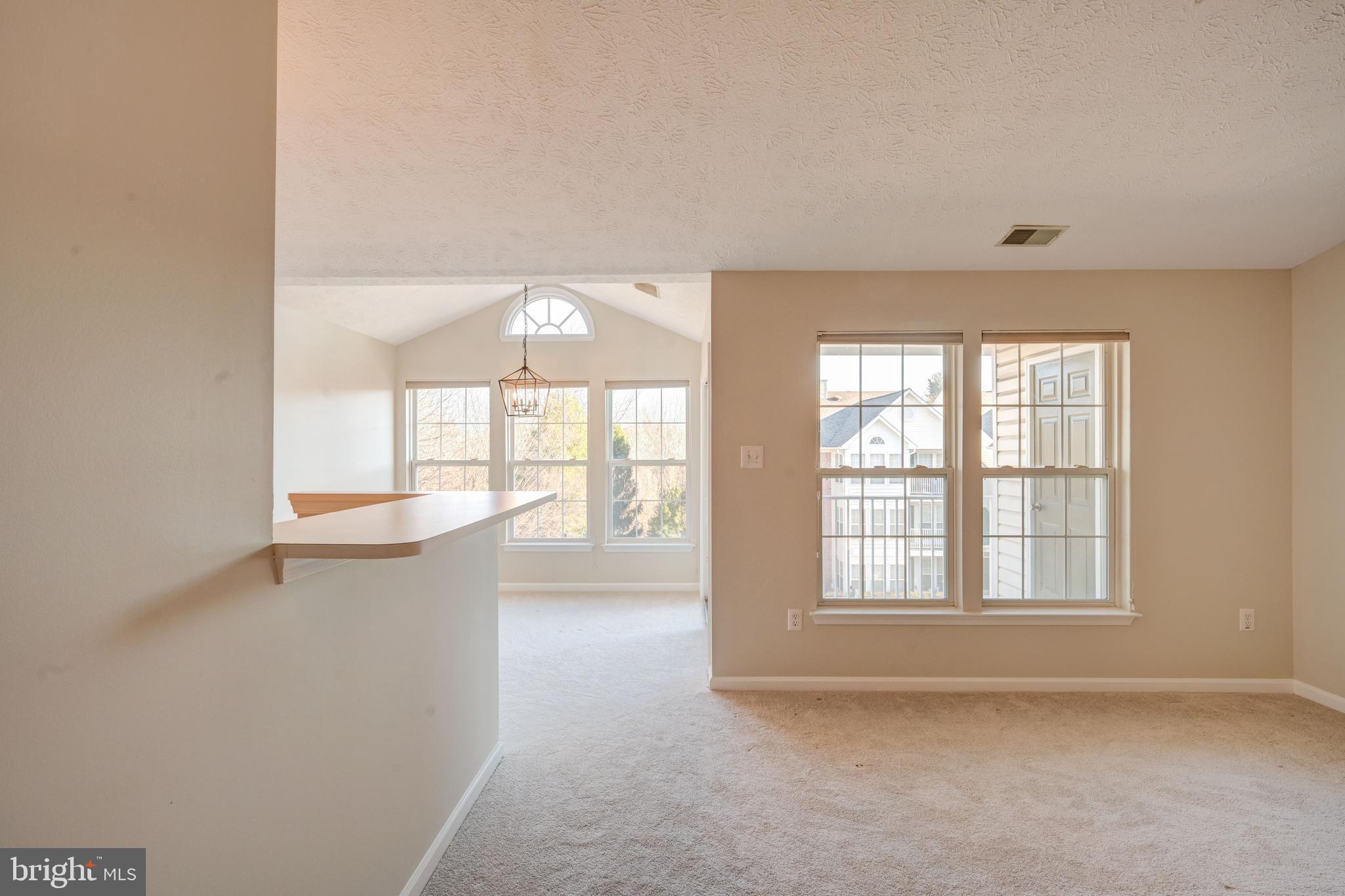 4933 Riders Court, Unit 4933 Owings Mills, MD 21117 - Photo 12 of 32 a view of an empty room with a window