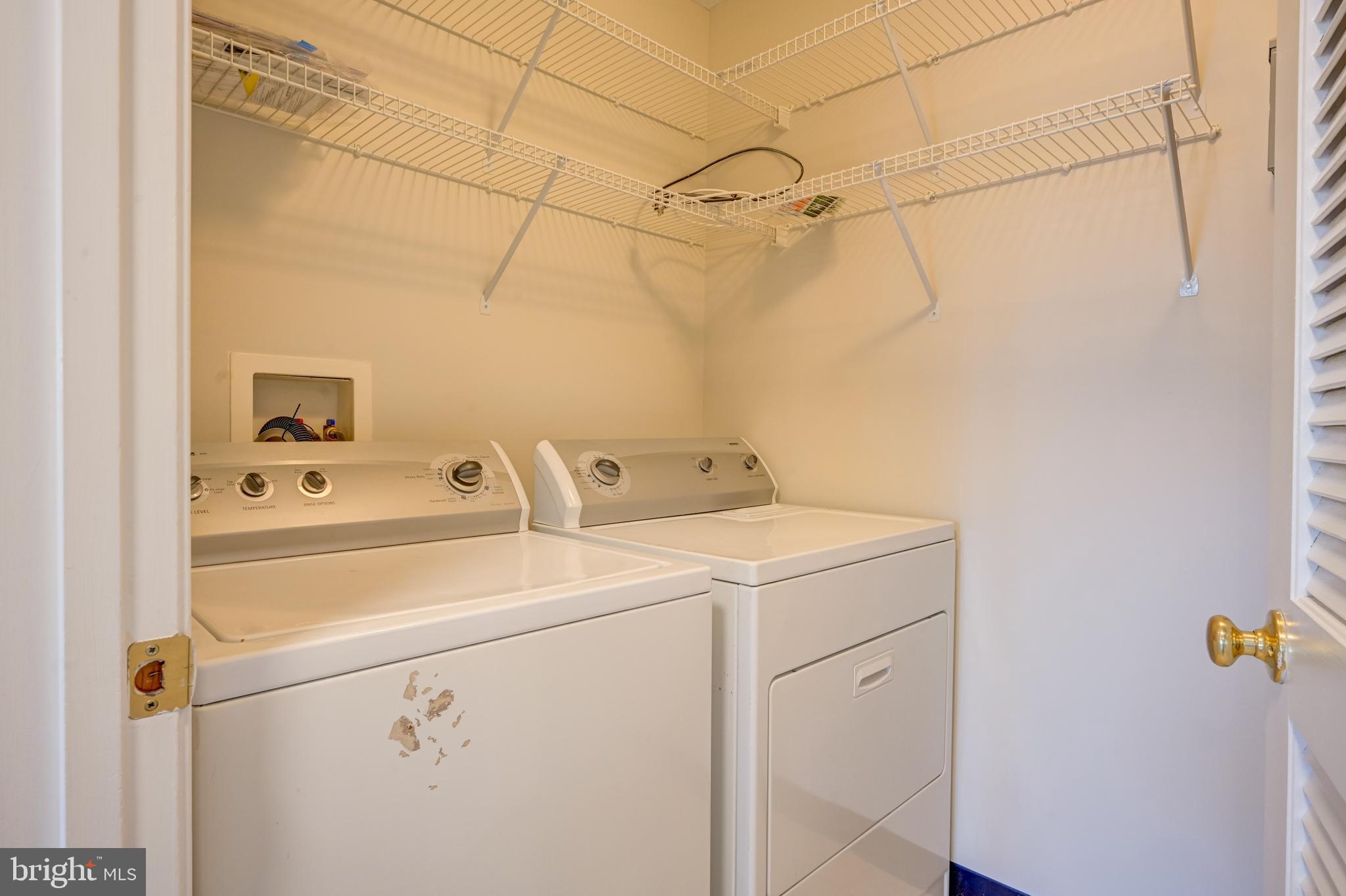 4933 Riders Court, Unit 4933 Owings Mills, MD 21117 - Photo 16 of 32 a utility room with dryer and washer