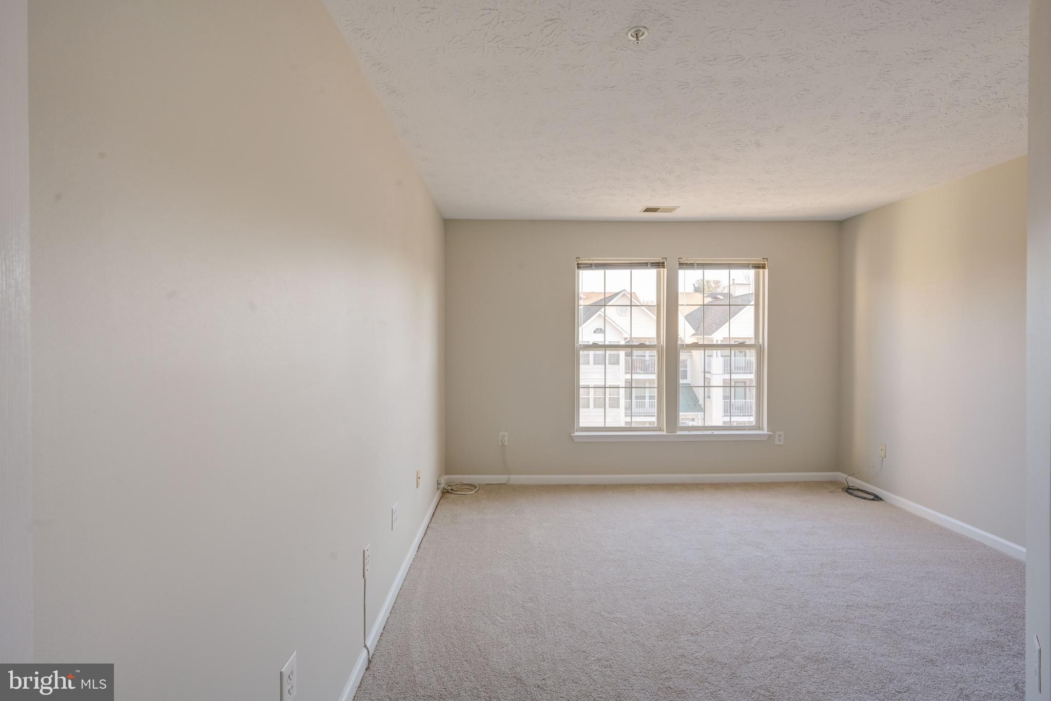 4933 Riders Court, Unit 4933 Owings Mills, MD 21117 - Photo 20 of 32 an empty room with a window