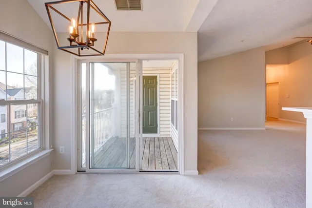 a bathroom with a granite countertop toilet and a sink