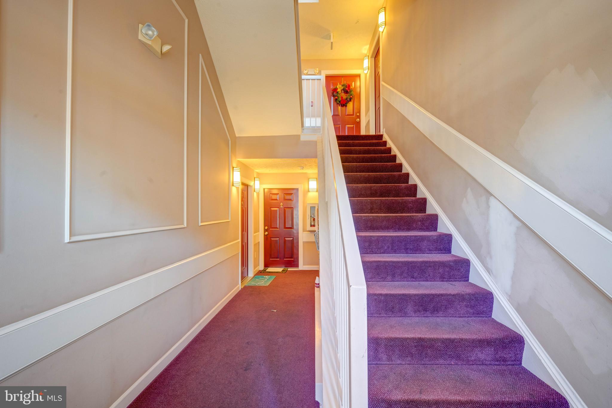 4933 Riders Court, Unit 4933 Owings Mills, MD 21117 - Photo 3 of 32 a view of entryway and gallery with wooden floor
