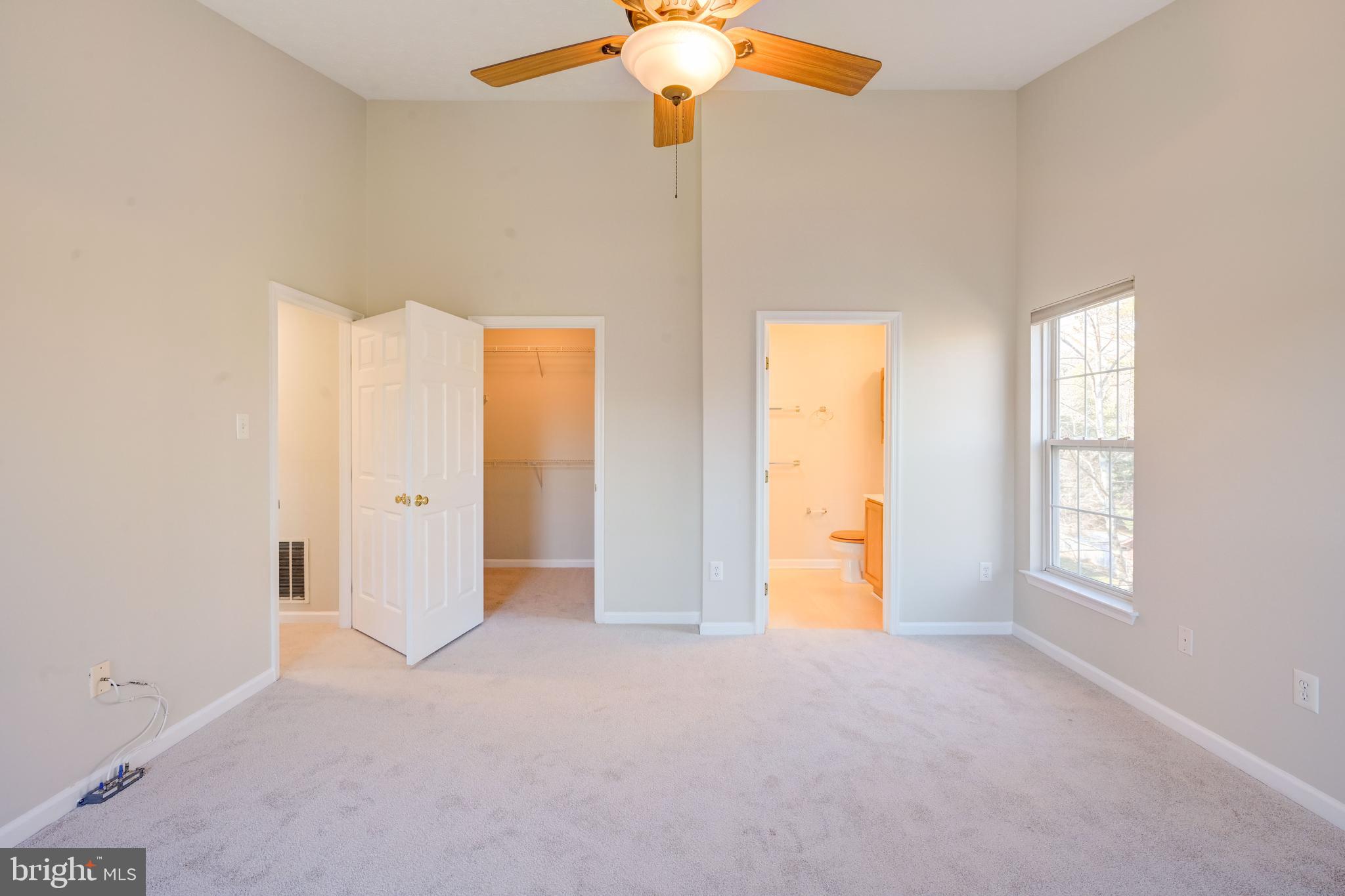 4933 Riders Court, Unit 4933 Owings Mills, MD 21117 - Photo 5 of 32 a view of an empty room with window