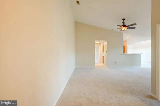 a view of a house with a ceiling fan and a window