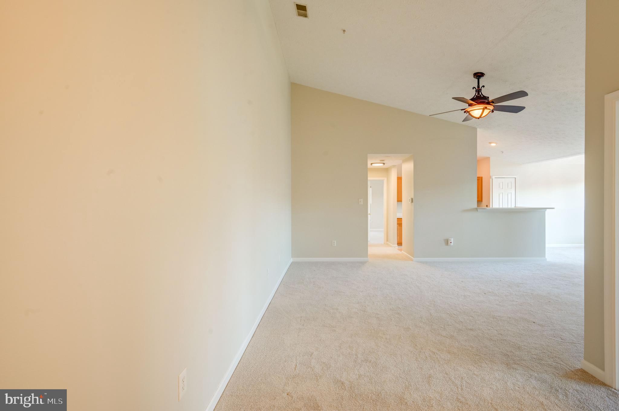 4933 Riders Court, Unit 4933 Owings Mills, MD 21117 - Photo 9 of 32 a view of a house with a ceiling fan and a window