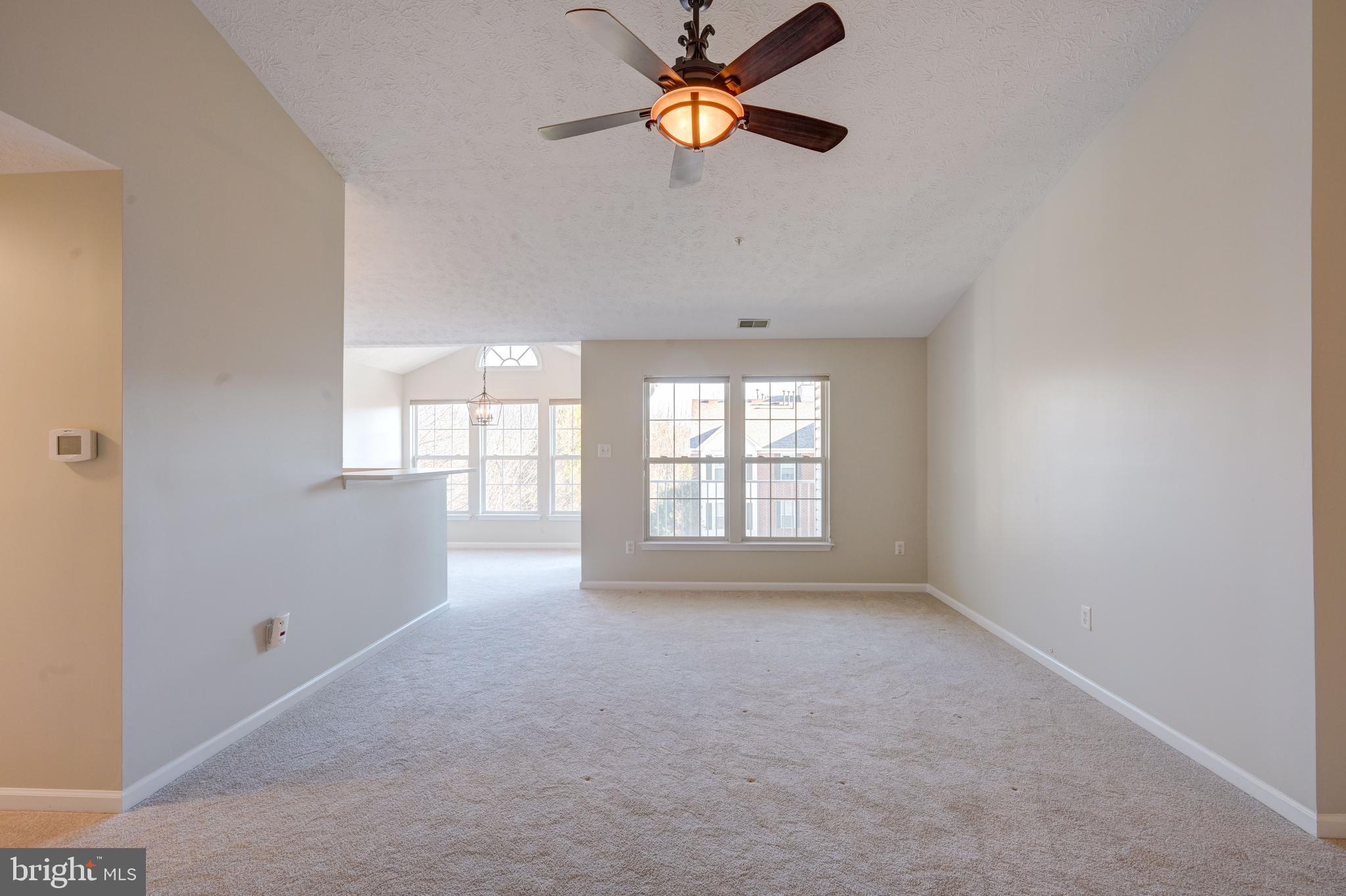 4933 Riders Court, Unit 4933 Owings Mills, MD 21117 - Photo 10 of 32 a view of an empty room with a window