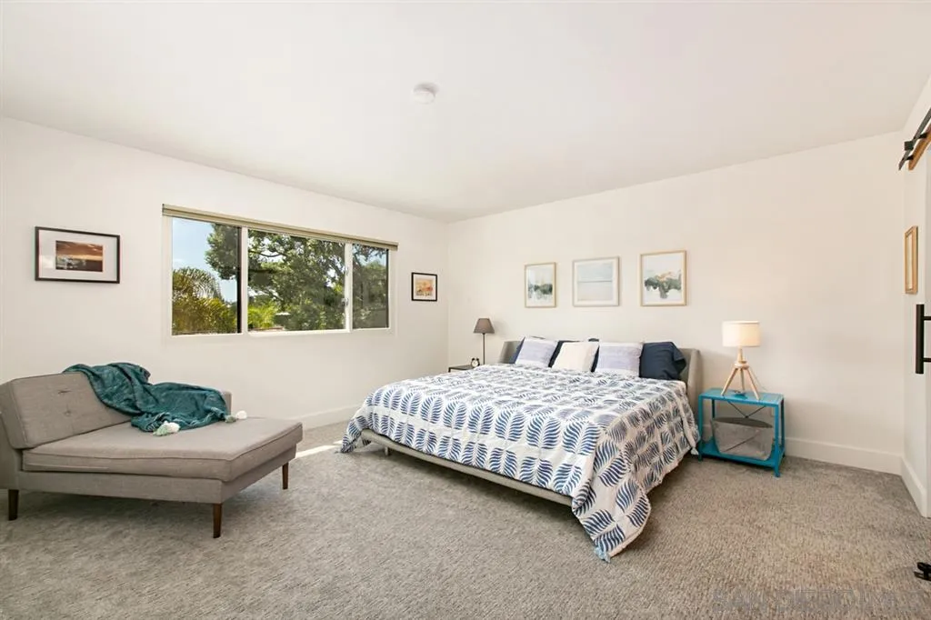 13637 Calais Drive Del Mar, CA 92014 - Photo 14 of 25 a bedroom with a bed and a couch