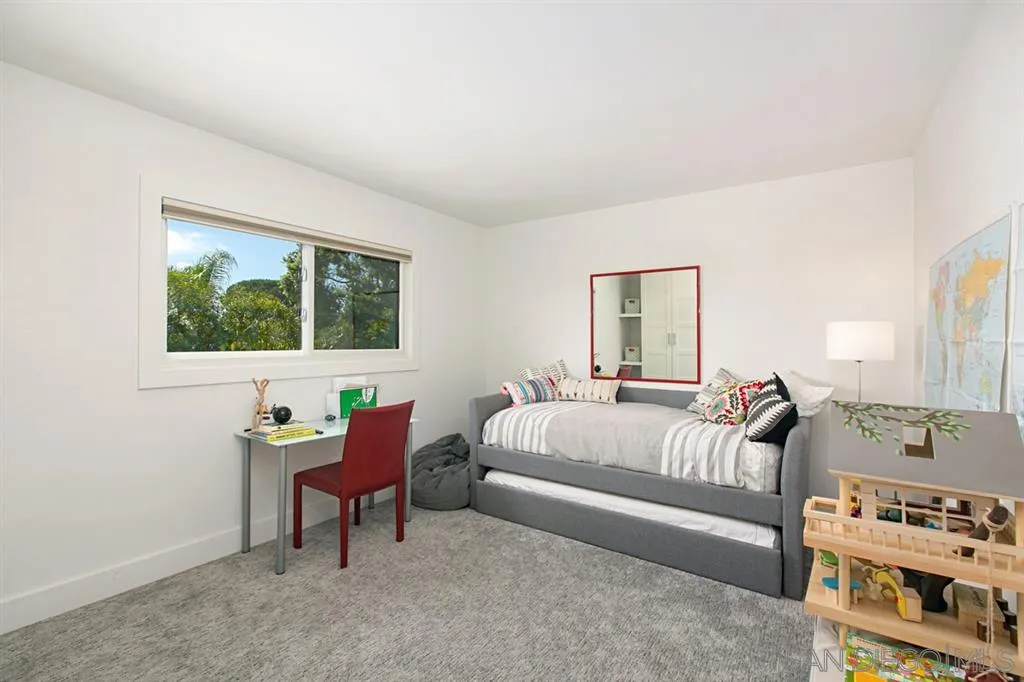 13637 Calais Drive Del Mar, CA 92014 - Photo 17 of 25 a bedroom with furniture and a window