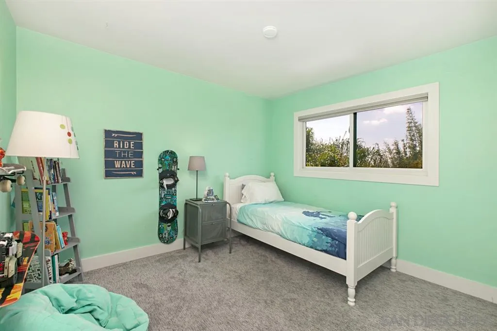 13637 Calais Drive Del Mar, CA 92014 - Photo 19 of 25 a bedroom with a bed and a window