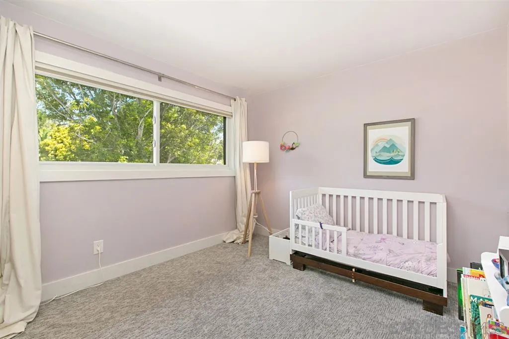 13637 Calais Drive Del Mar, CA 92014 - Photo 20 of 25 a bedroom with a bed and a window