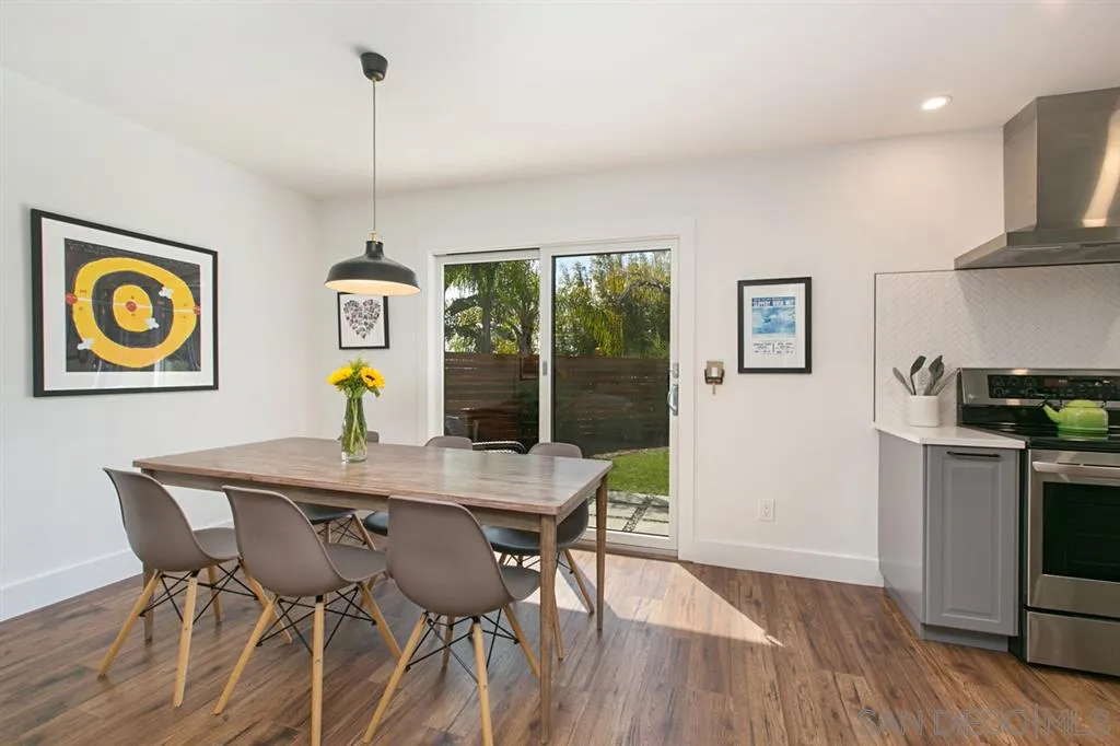13637 Calais Drive Del Mar, CA 92014 - Photo 7 of 25 a view of a dining room with furniture window and wooden floor