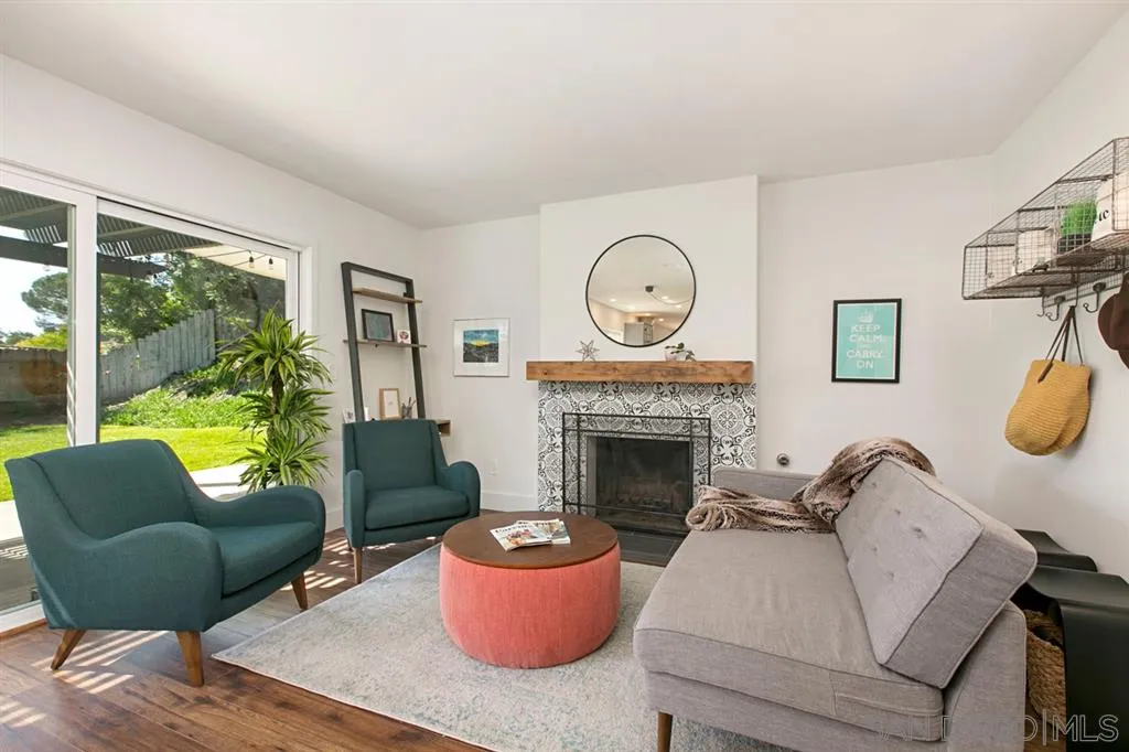 13637 Calais Drive Del Mar, CA 92014 - Photo 8 of 25 a living room with furniture and a fireplace